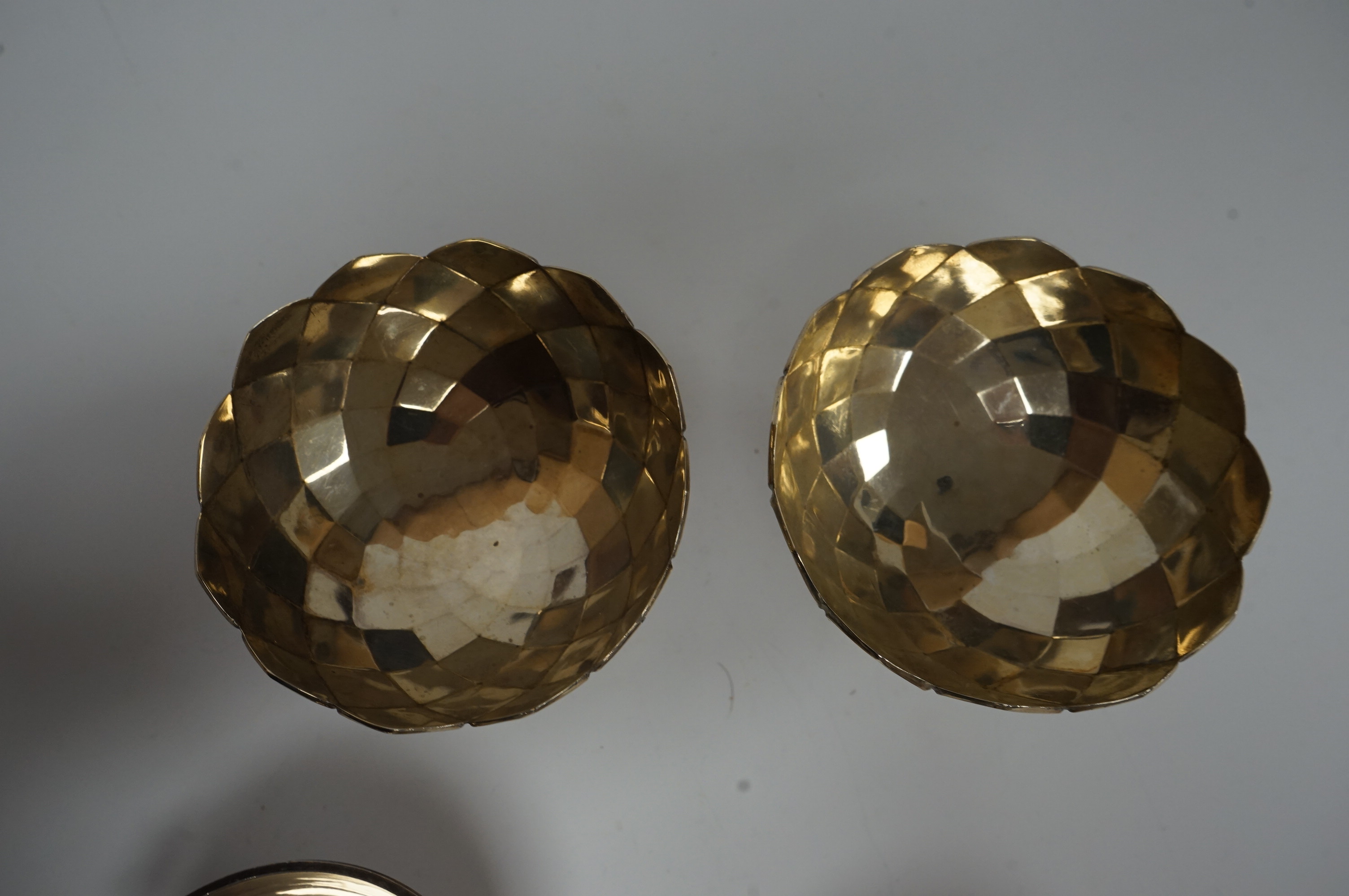 A pair of Elizabeth II silver two handled circular pedestal salts, by Walker & Hall, Sheffield, 1964, diameter 78mm, together with a small pair of George V silver pedestal bowls, Mappin & Webb, Birmingham, 1928, 10.3oz.